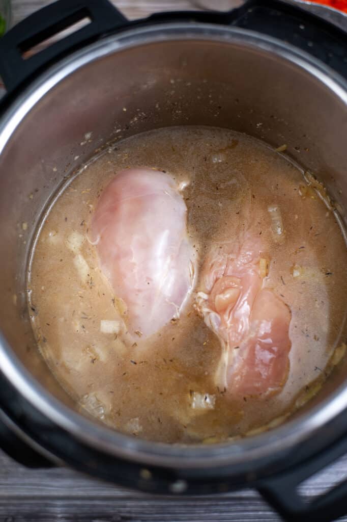 chicken simmering in instant pot